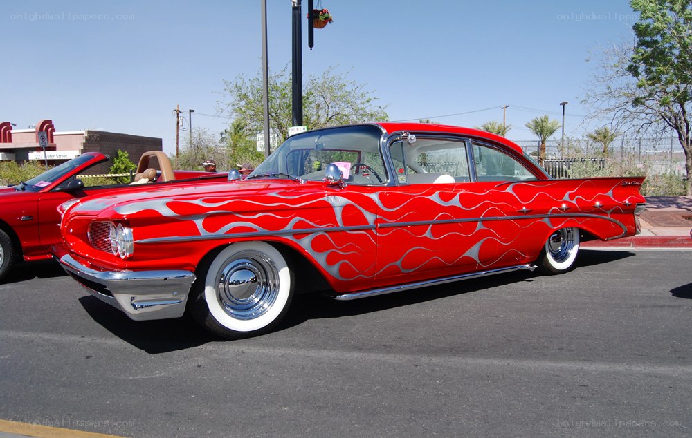 Red flame-painted classic car