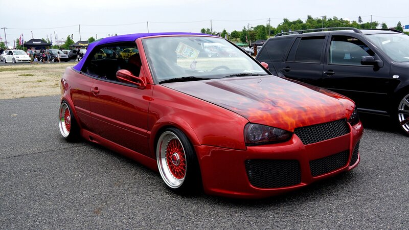 Red flame-painted convertible car
