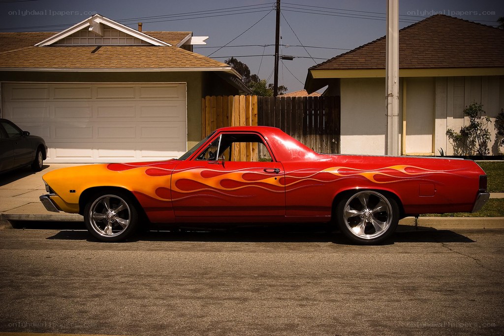 Red flame-painted pickup truck