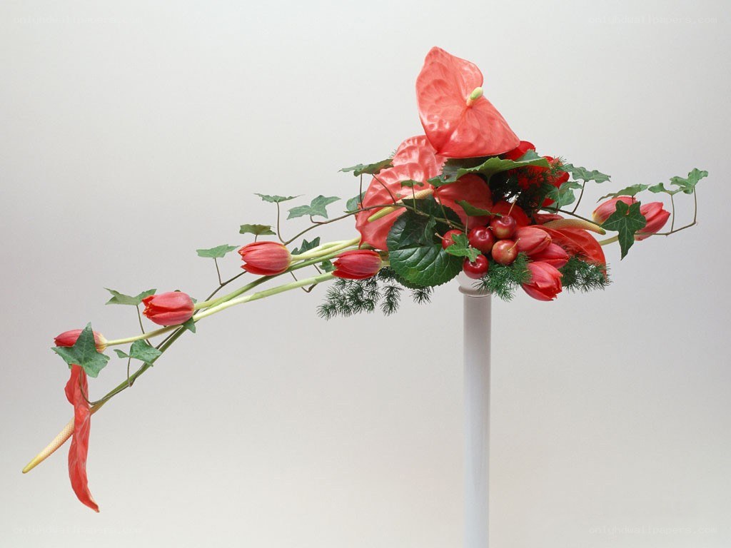 Red floral arrangement on stand