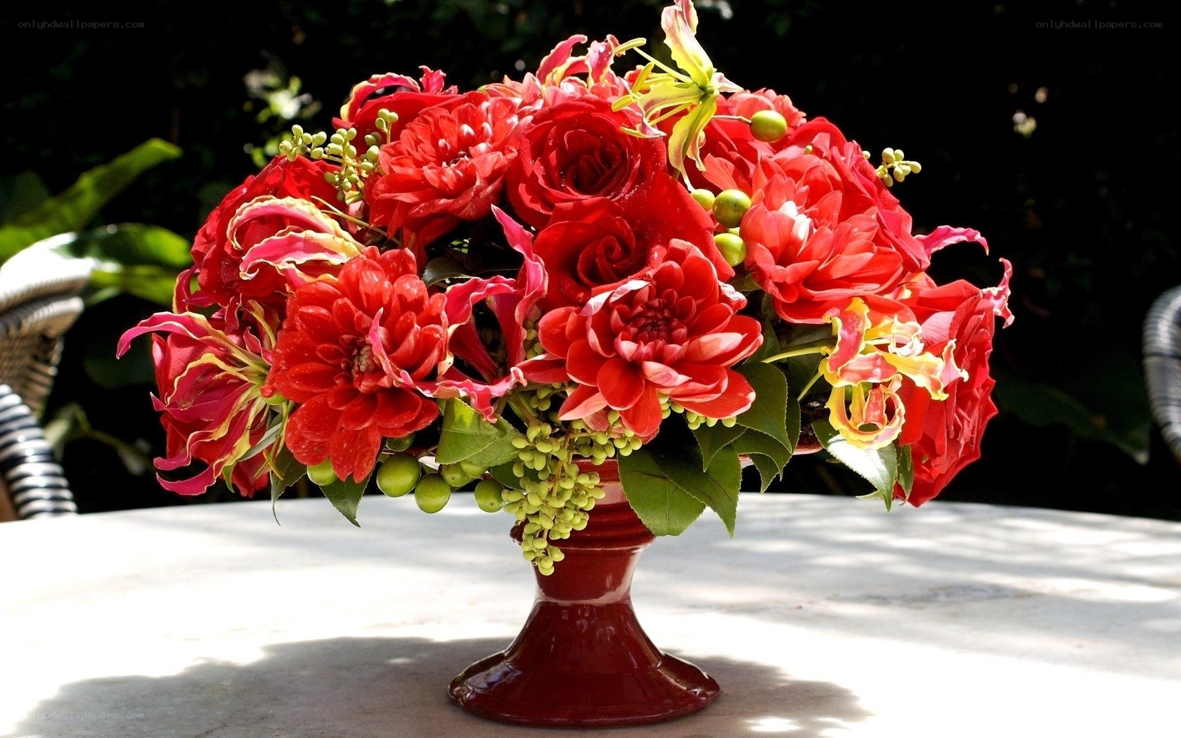 Red floral arrangement on table
