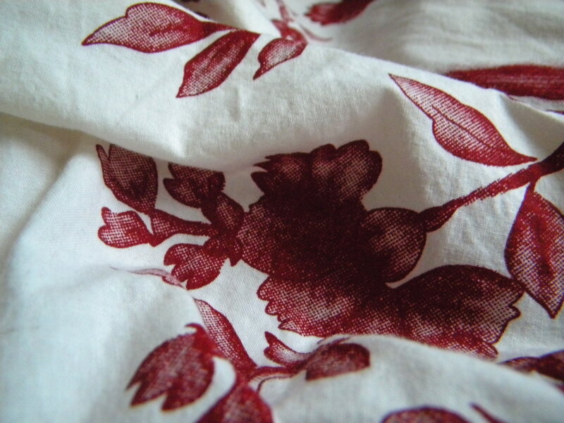 red floral pattern on white fabric