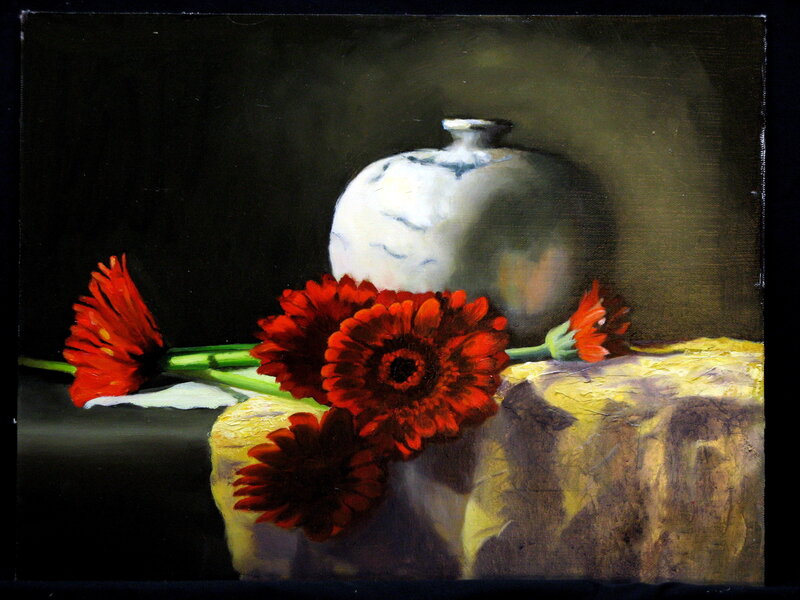 Red flowers and white vase