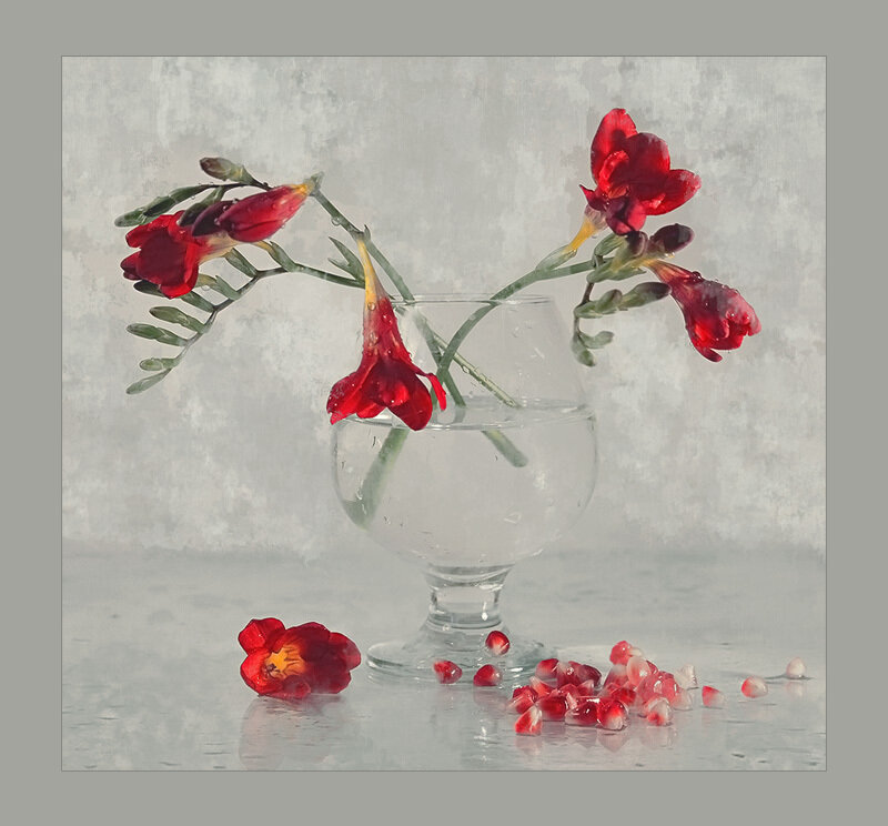 Red Flowers in Glass Vase