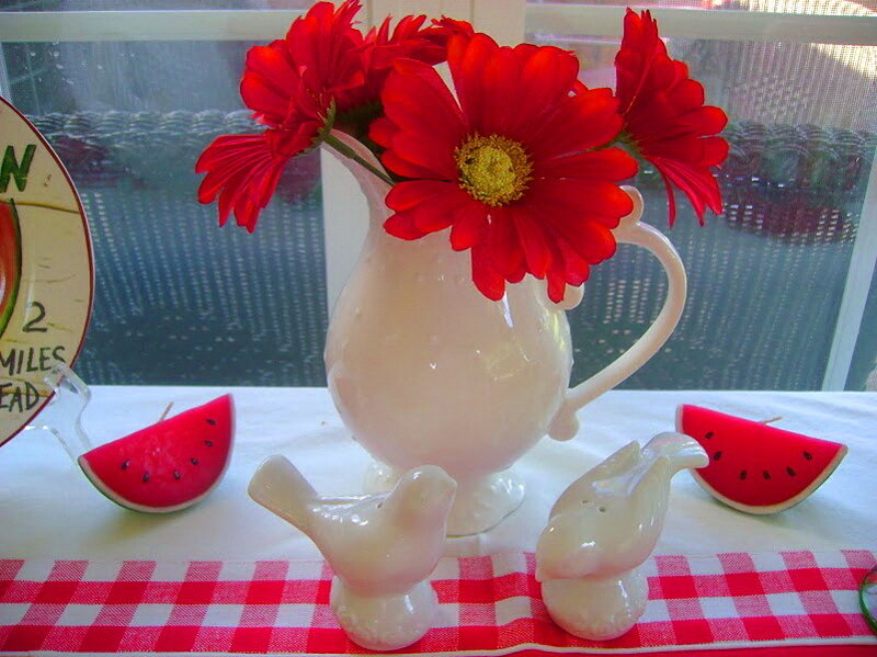 Red Flowers in White Pitcher