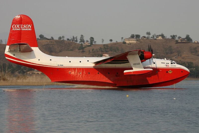 Red flying boat on water
