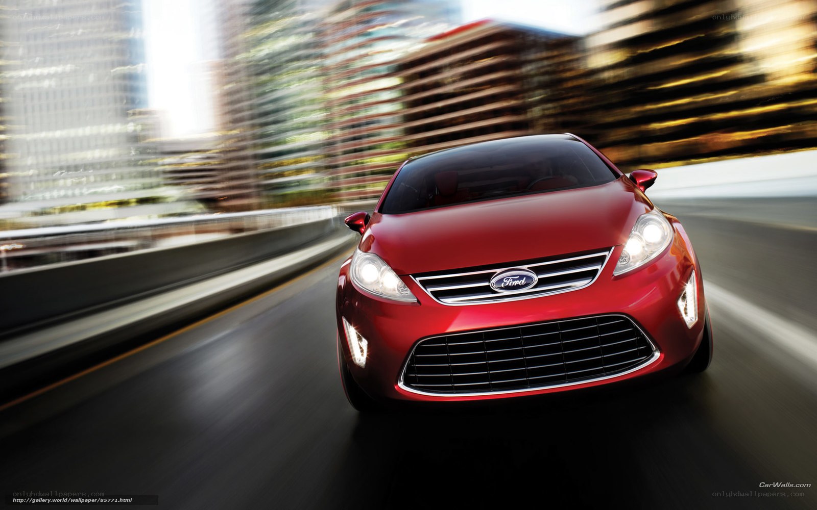 Red Ford car in motion