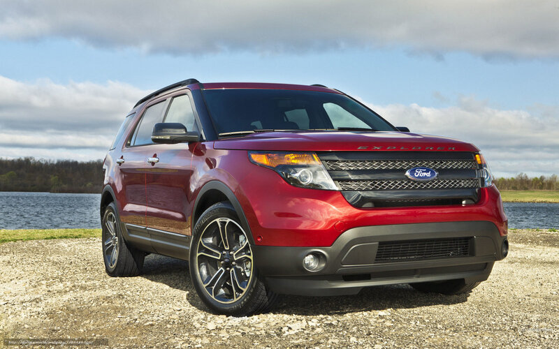 Red Ford Explorer by a lake