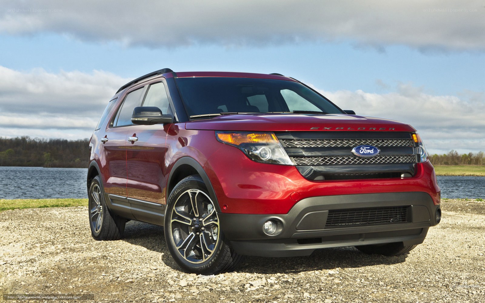 Red Ford Explorer by a lake