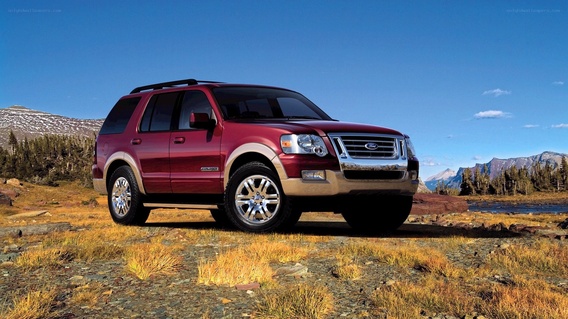 Red Ford Explorer in mountain landscape