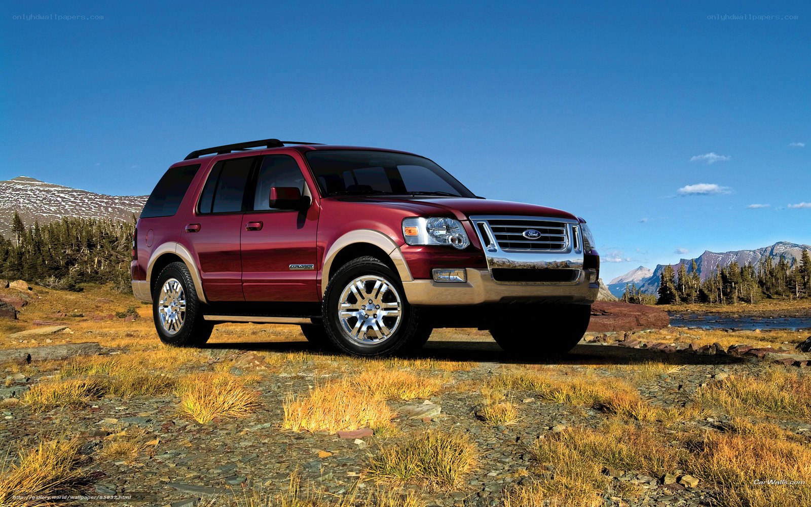 Red Ford Explorer in mountain landscape