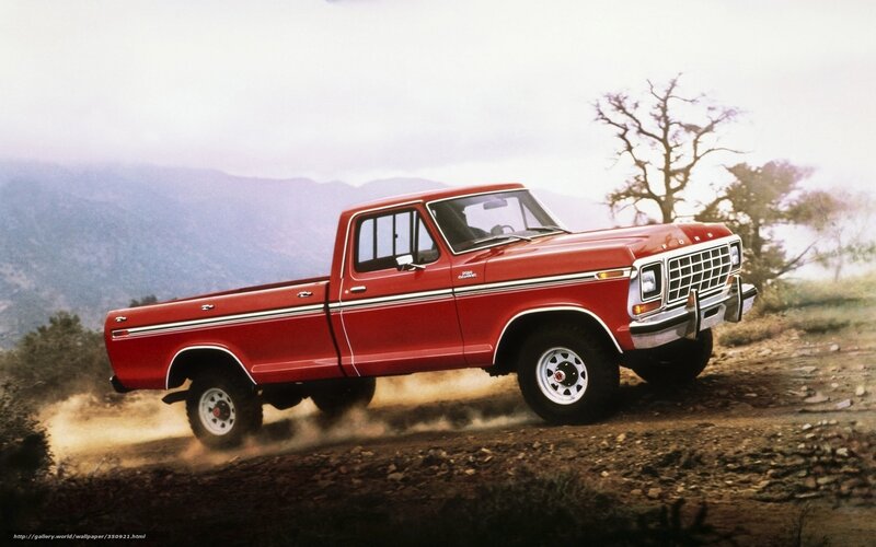 Red Ford F-150 on dirt road