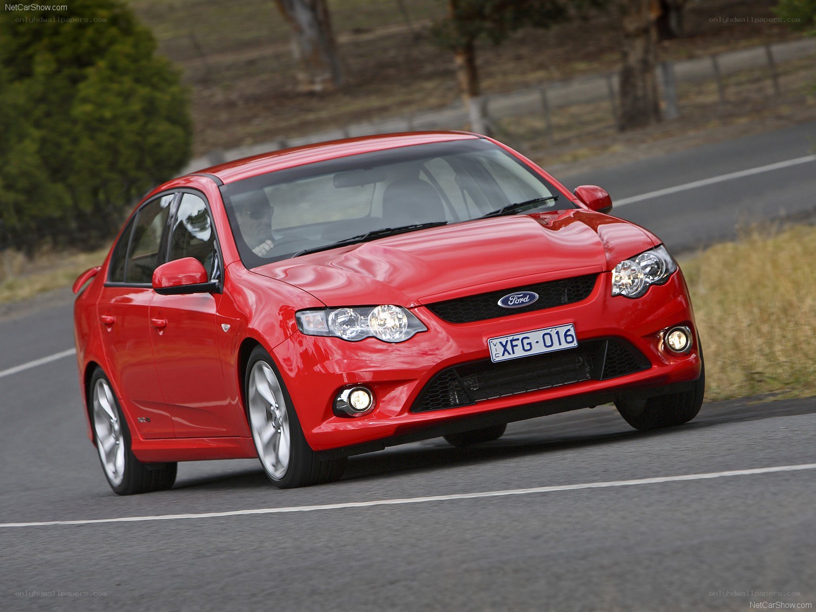 red ford falcon on road