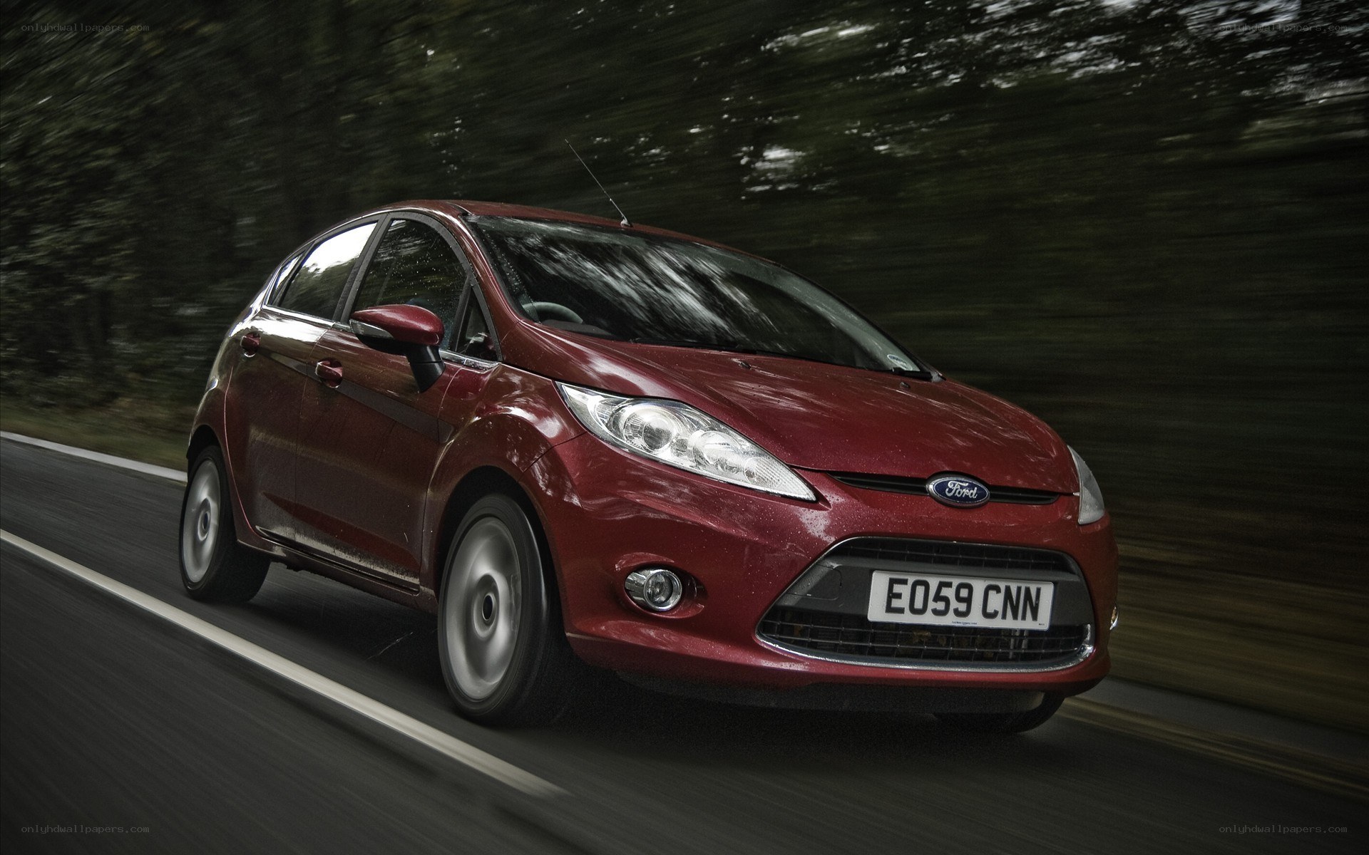 Red Ford Fiesta in motion