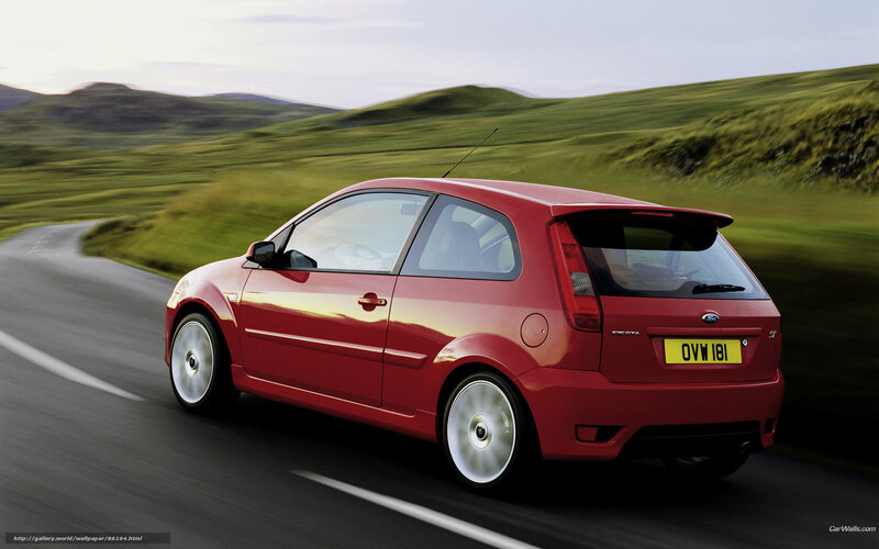 Red Ford Fiesta on a country road