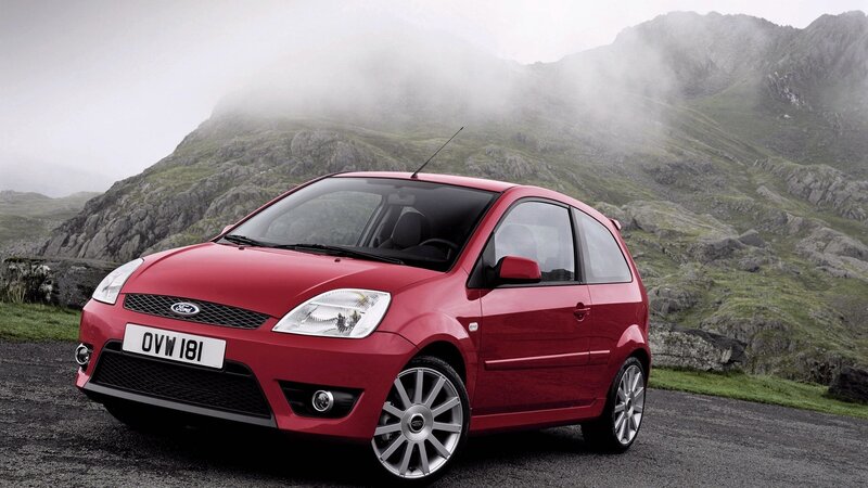 Red Ford Fiesta on a mountain road