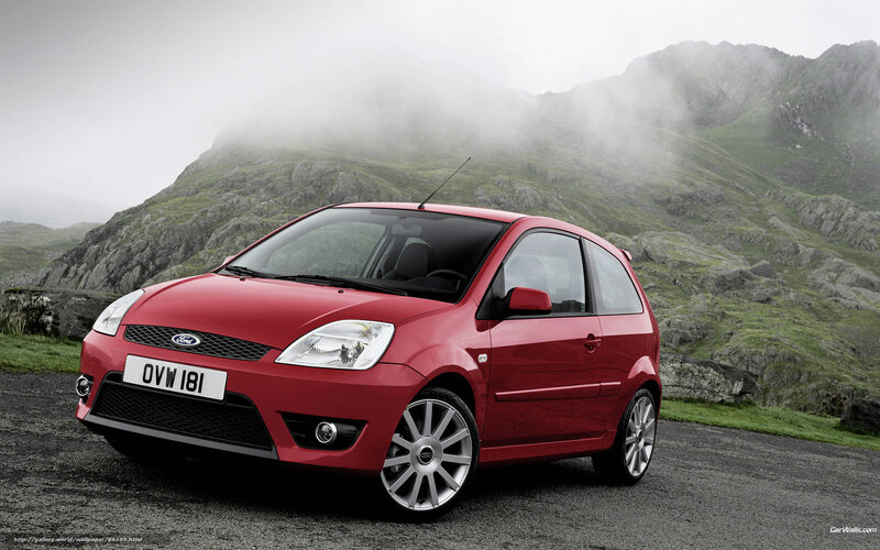 Red Ford Fiesta on a mountain road