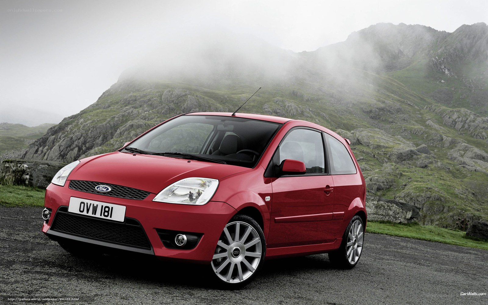 Red Ford Fiesta on a mountain road