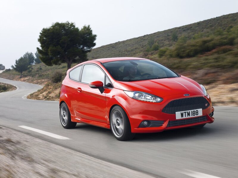 Red Ford Fiesta ST on a winding road