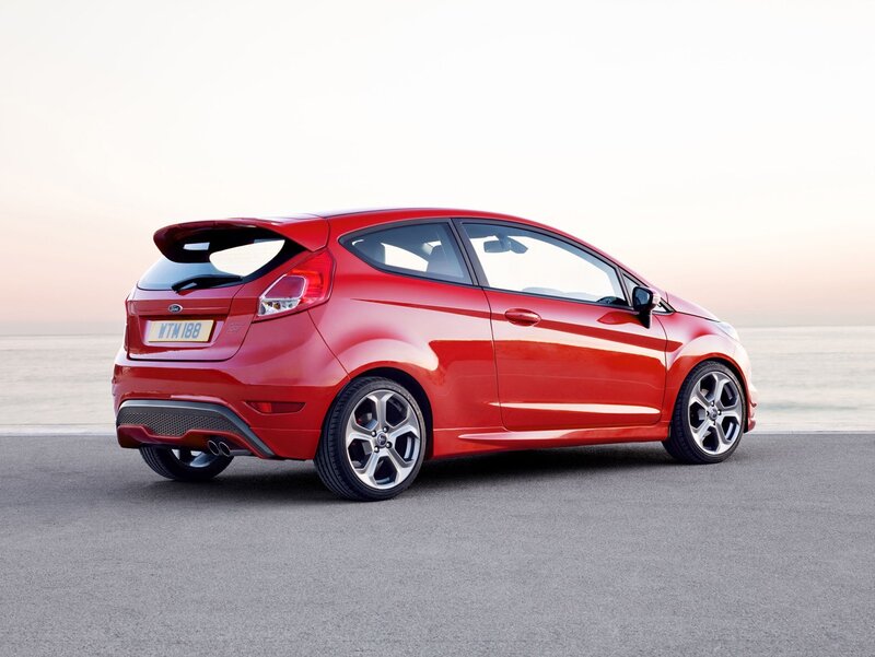 Red Ford Fiesta ST parked by the sea