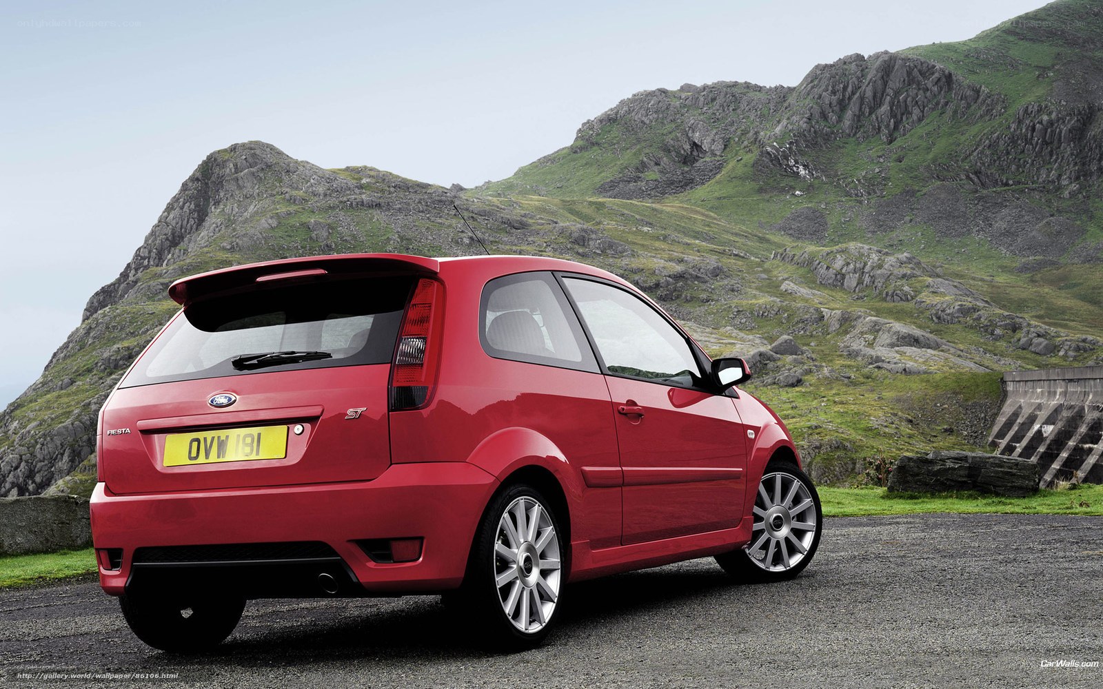 Red Ford Fiesta ST parked in mountains