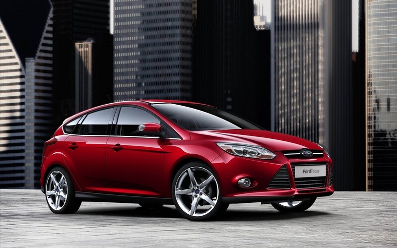 Red Ford Focus Hatchback — Dramatic, Photograph, City Buildings