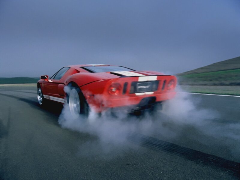 Red Ford GT burning rubber