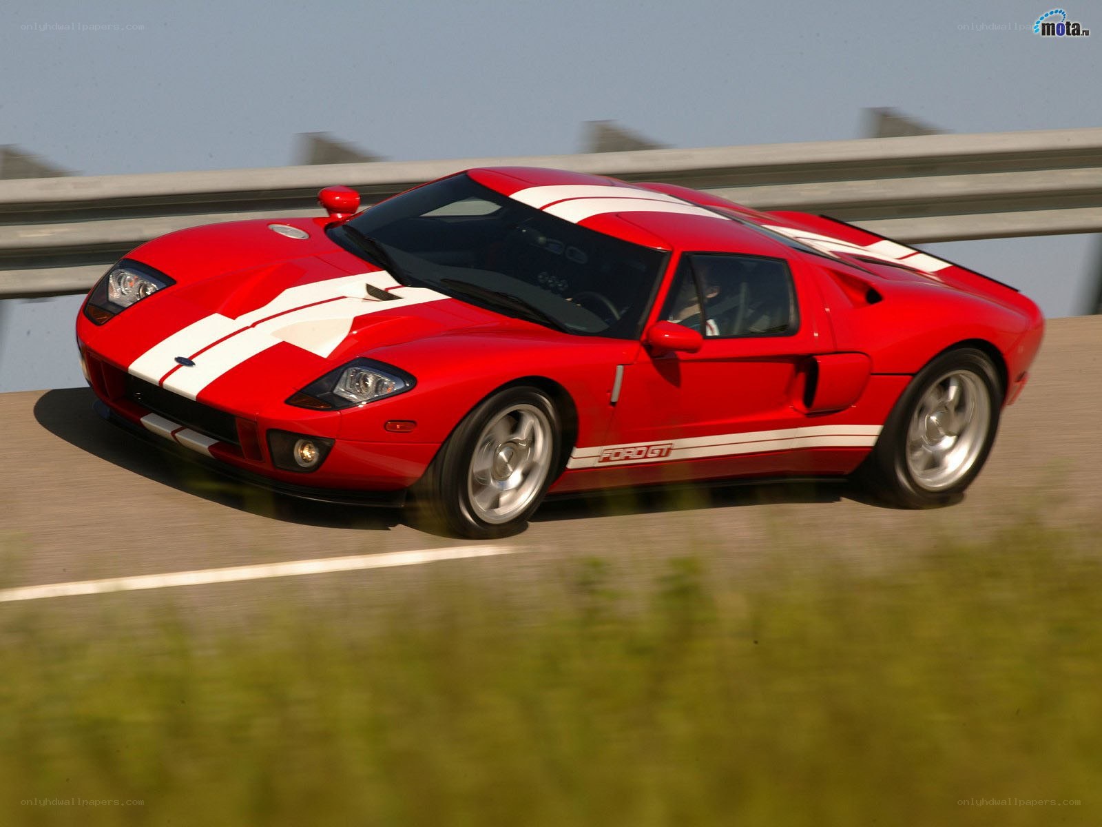 Red Ford GT on a road