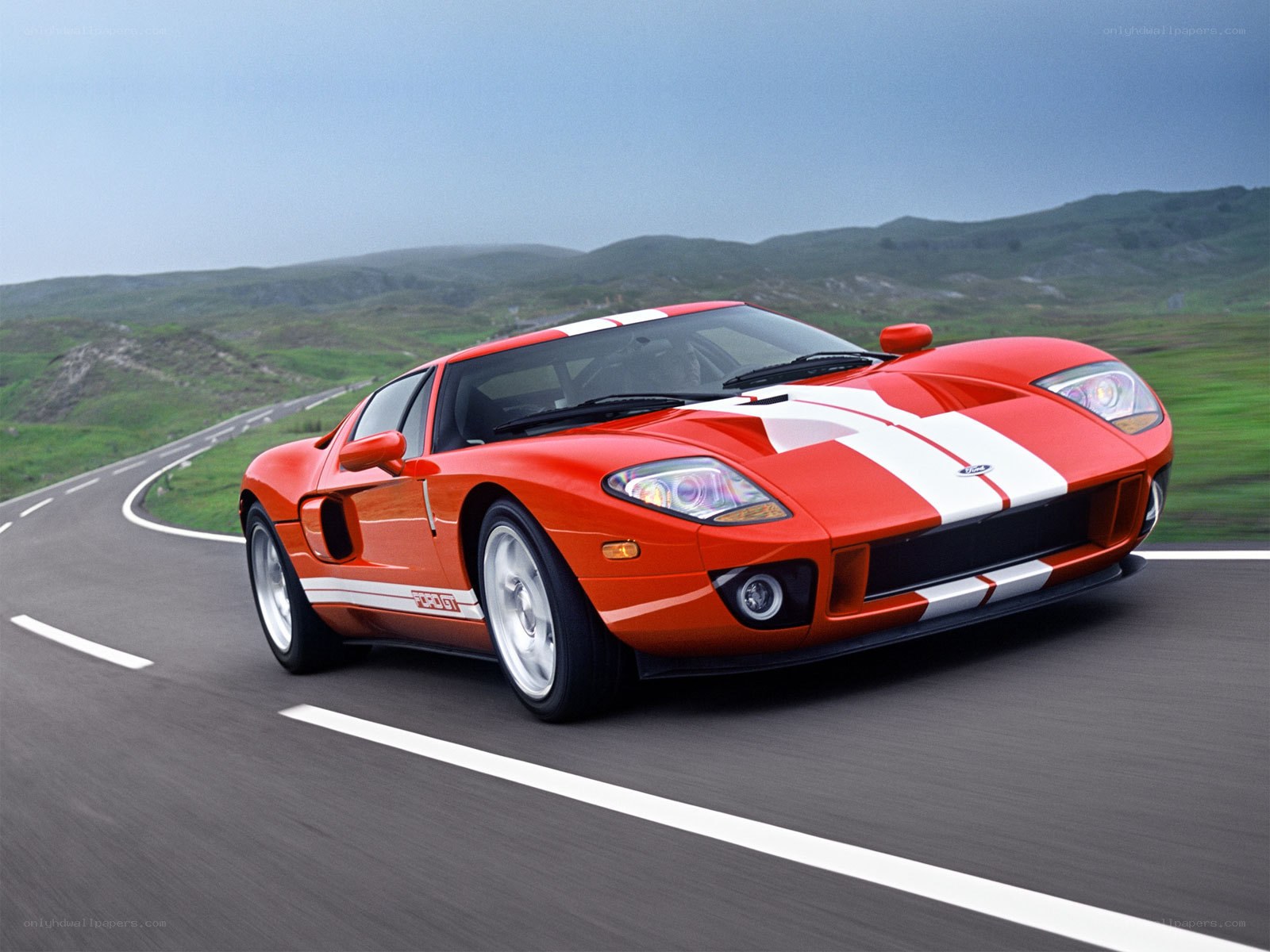 Red Ford GT on a winding road