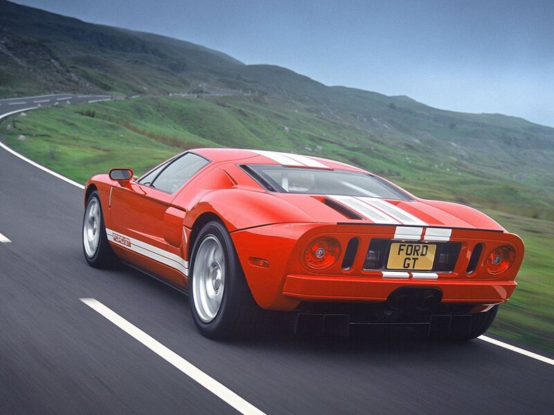 Red Ford GT on a winding road