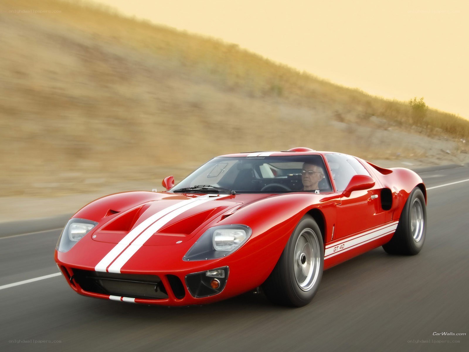 Red Ford GT40 on a road