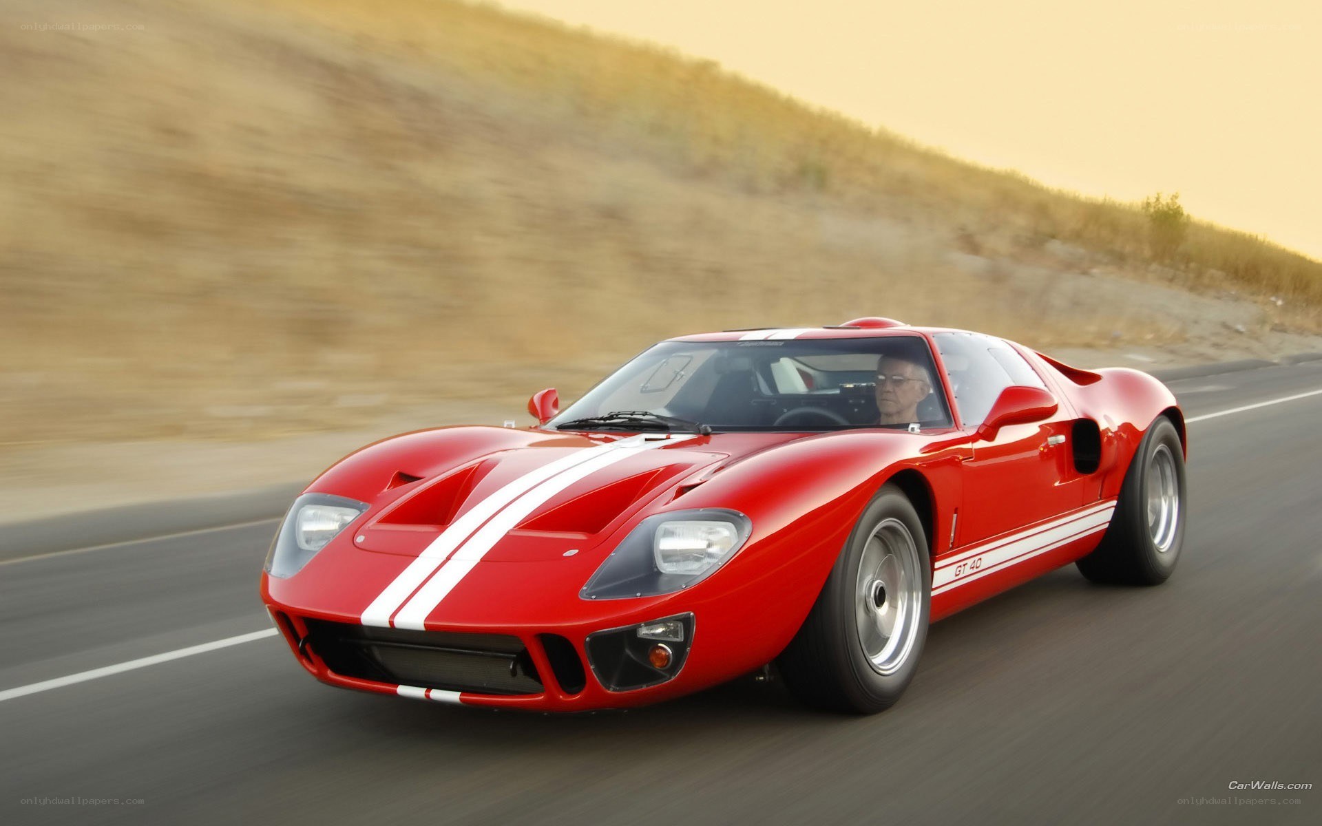 Red Ford GT40 on a road