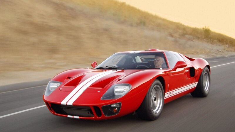 Red Ford GT40 on a road