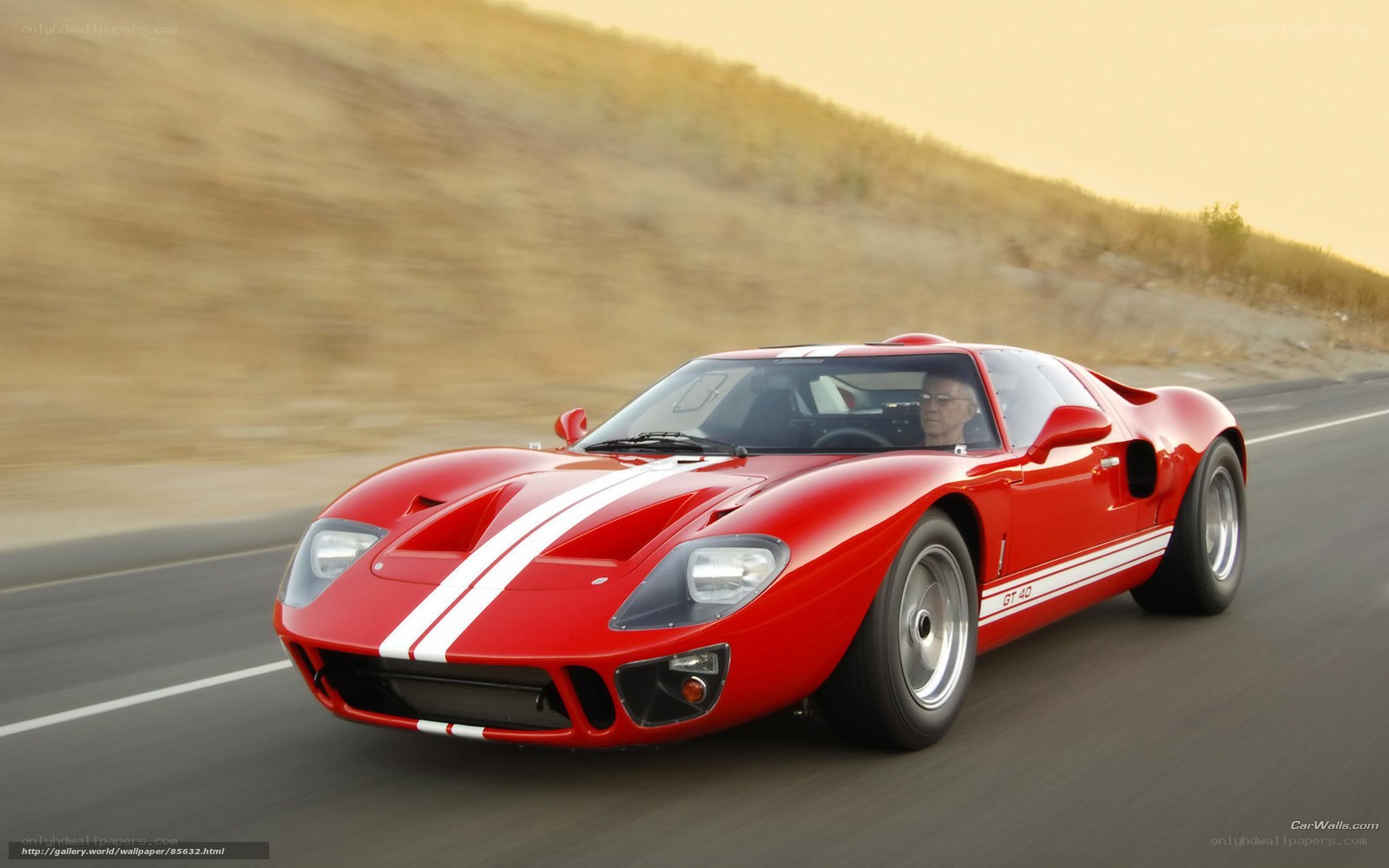 Red Ford GT40 on a road