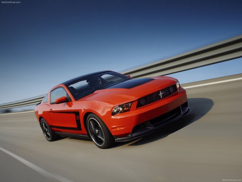 Red Ford Mustang Boss 302 on highway