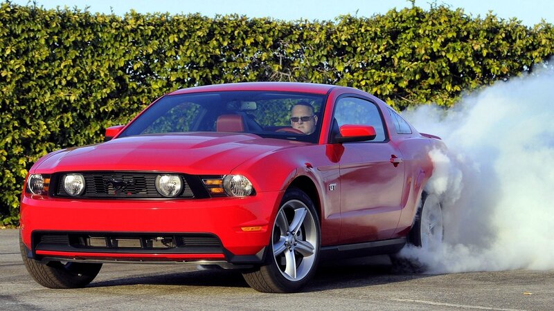Red Ford Mustang GT burnout