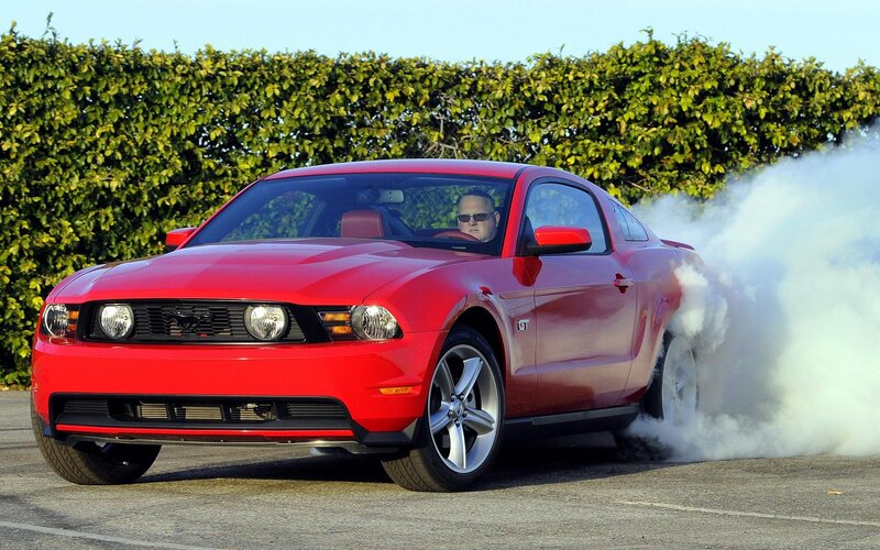 Red Ford Mustang GT burnout