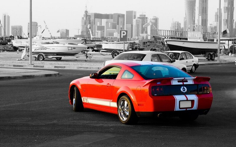 Red Ford Mustang GT in city