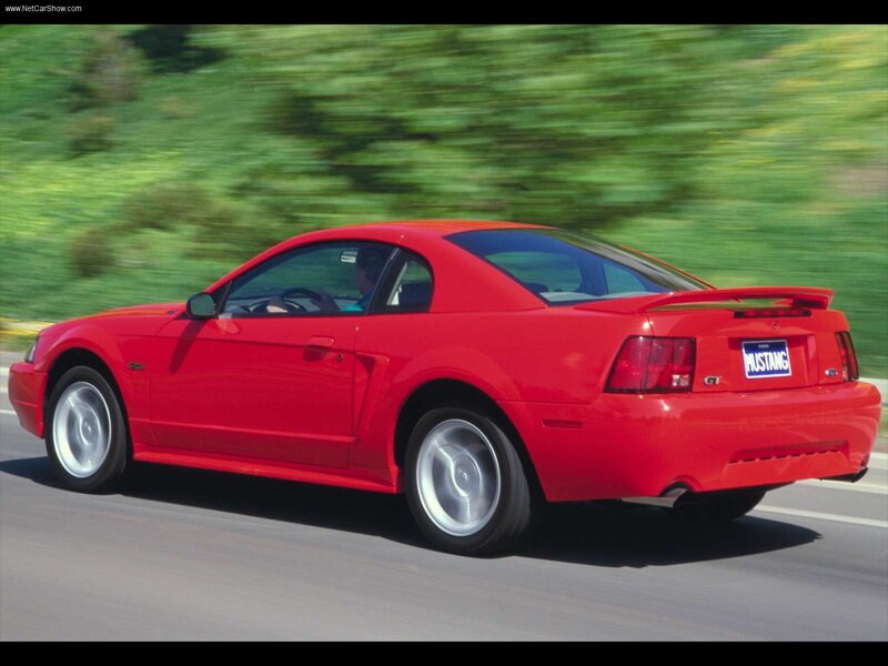 Red Ford Mustang GT in motion