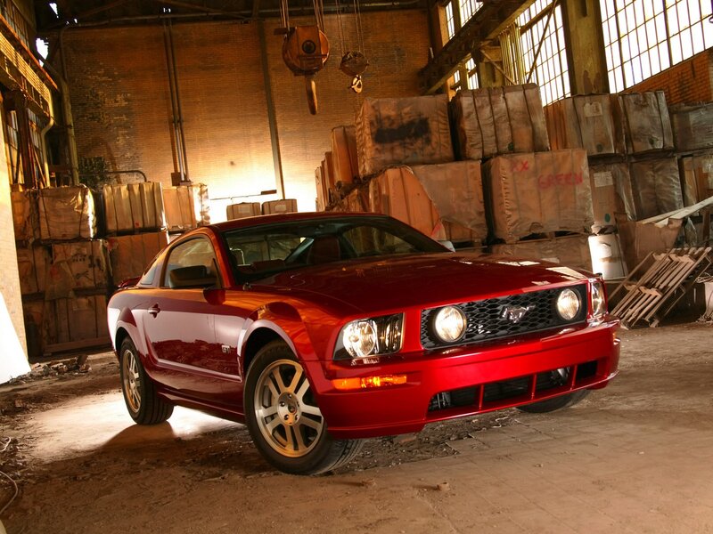 Red Ford Mustang GT in warehouse