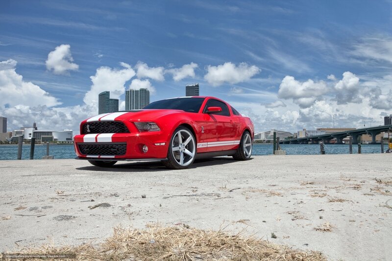 Red Ford Mustang GT on waterfront