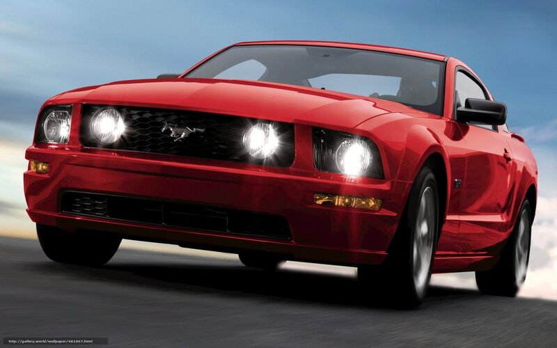 Red Ford Mustang in motion