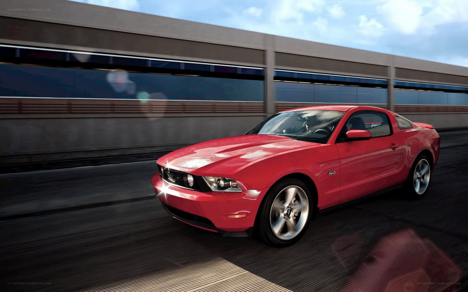 Red Ford Mustang in motion