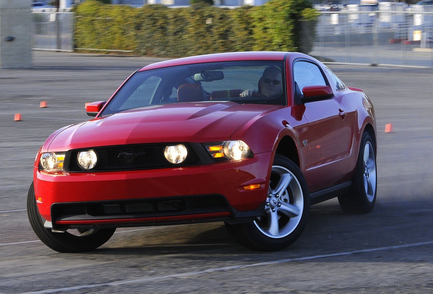 Red Ford Mustang in motion