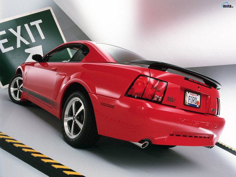 Red Ford Mustang in parking garage