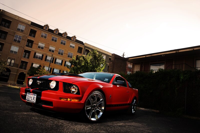 Red Ford Mustang in parking lot