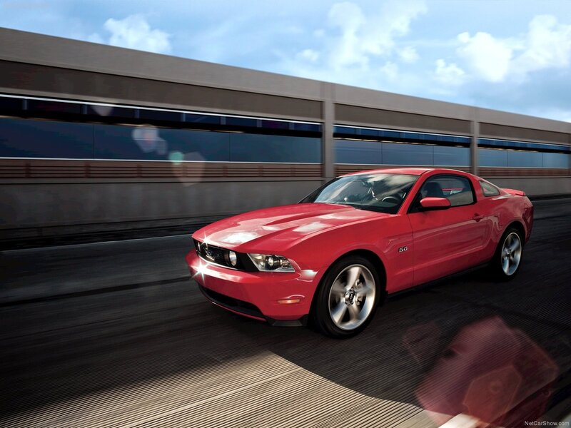 Red Ford Mustang on a highway