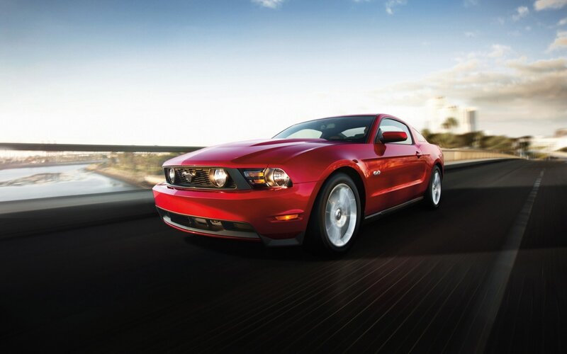 Red Ford Mustang on a highway