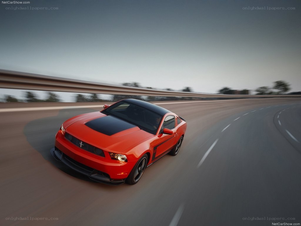 Red Ford Mustang on a highway