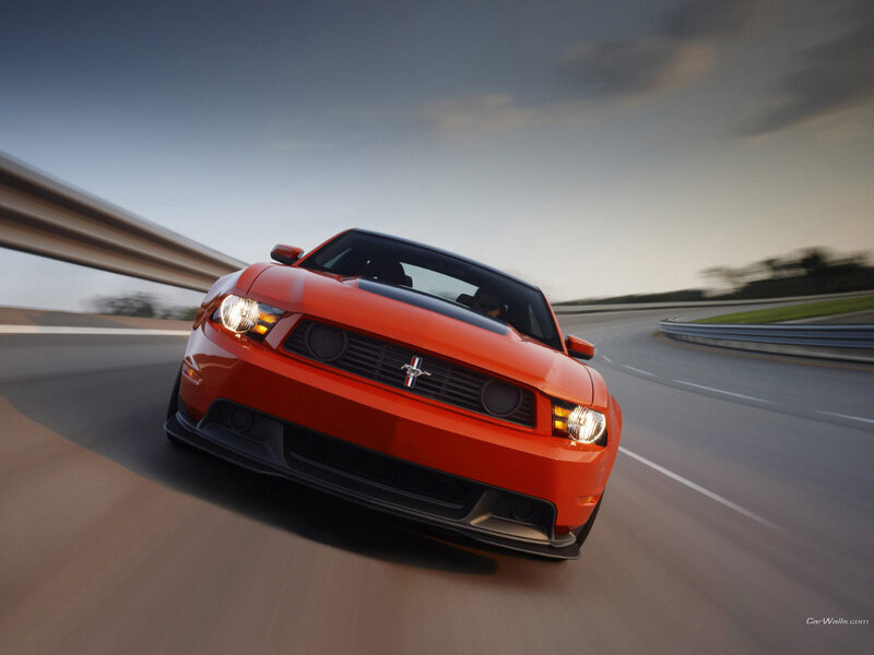 Red Ford Mustang on a racetrack